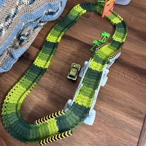 Dinosaur land racetrack with battery operated car